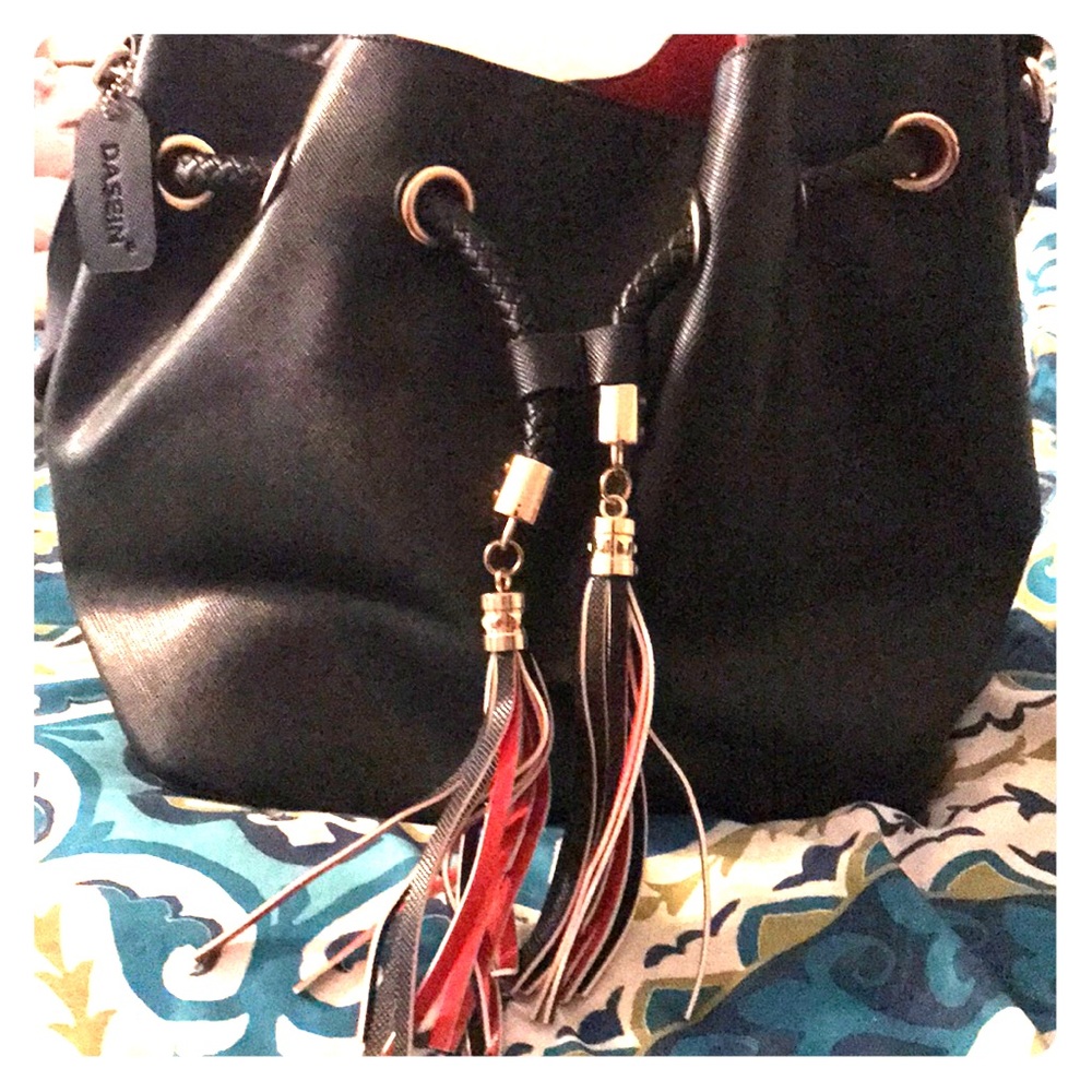 Black leather purse with red inside